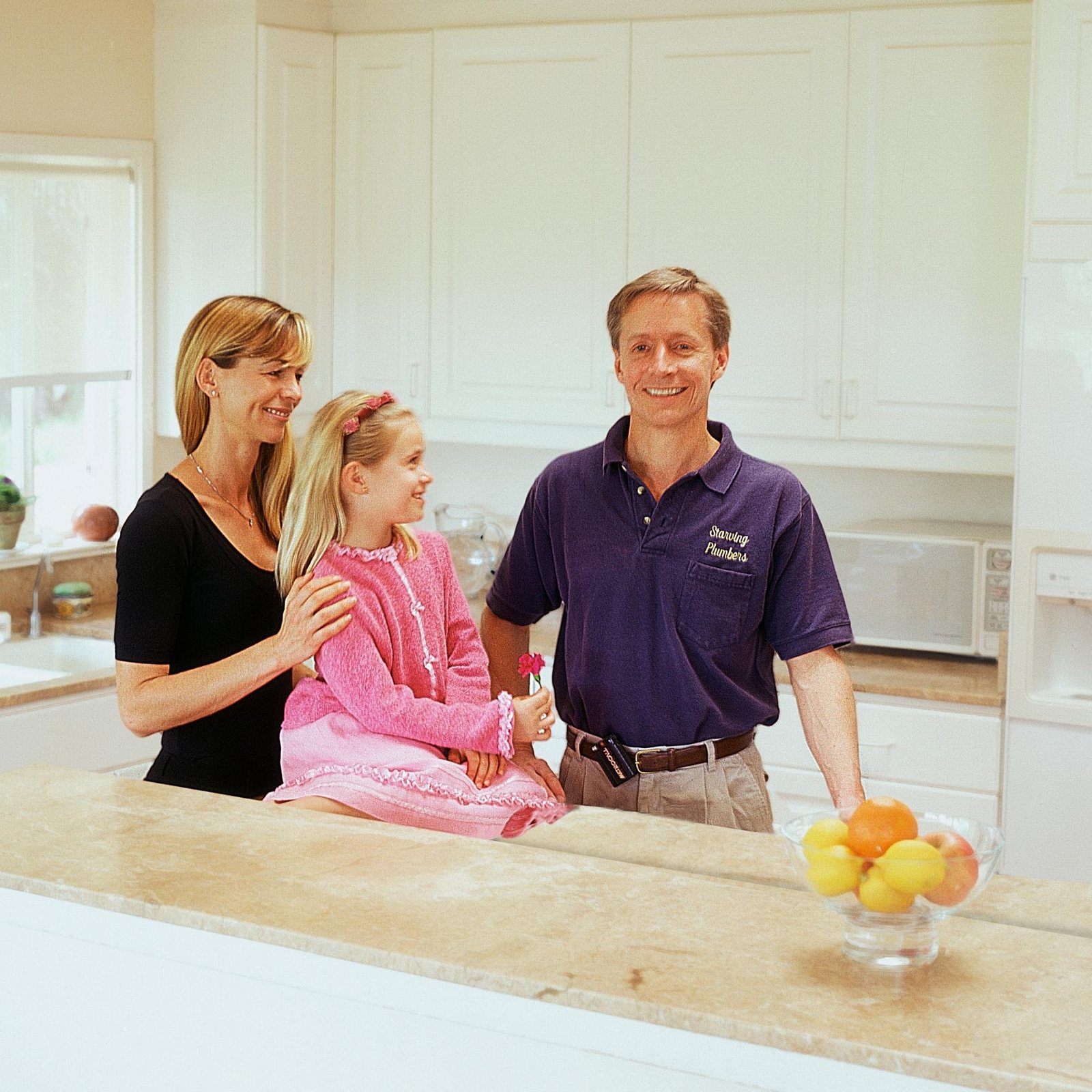 Illustrative photo: a family together in a kitchen